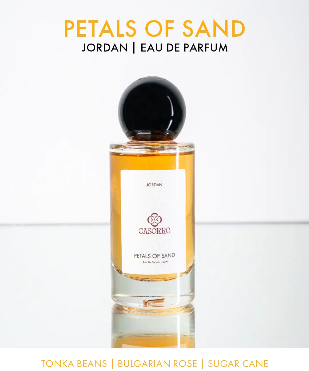 Perfume bottle labeled 'Petals of Sand' by CASORRO on a white background