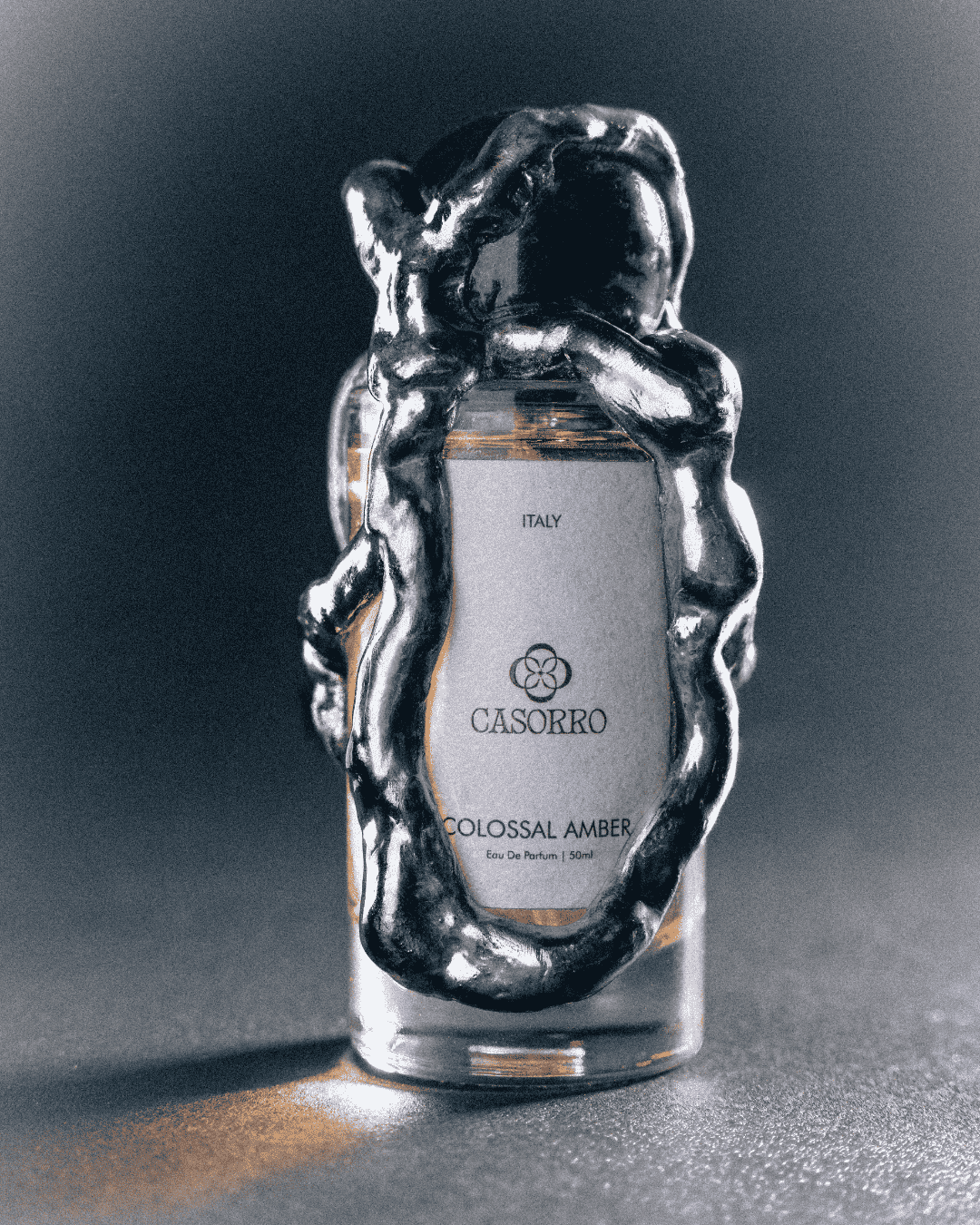 Perfume bottle with 'Casorro' branding on a dark background