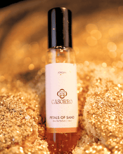 Perfume bottle labeled 'Casorro' on a glittery gold background