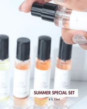 Four Casorro perfume bottles on a stone surface with floral decorations.